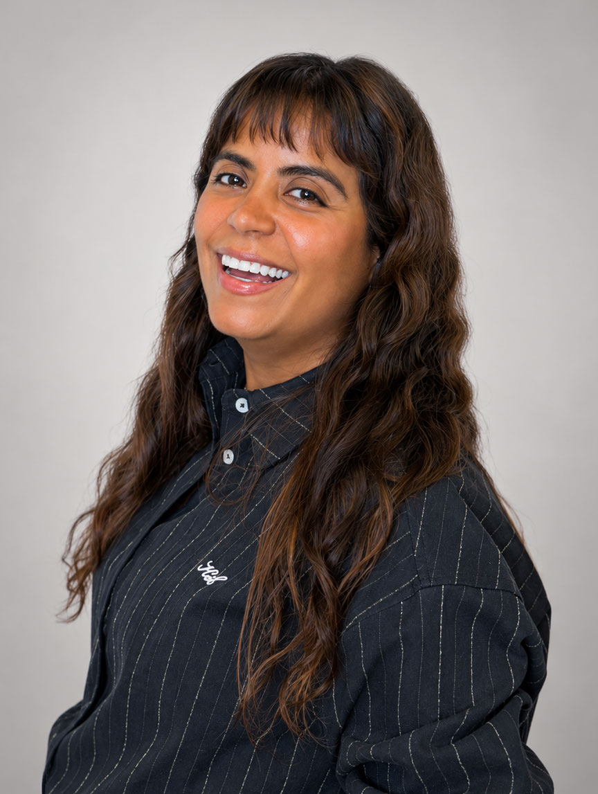 Women smiling wearing dark long shirt